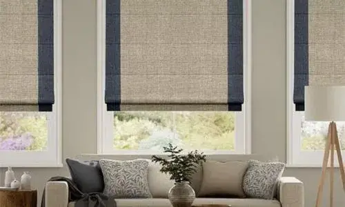 A bedroom with floor-to-ceiling blackout curtains, creating a dark and cozy sleeping environment.bleed