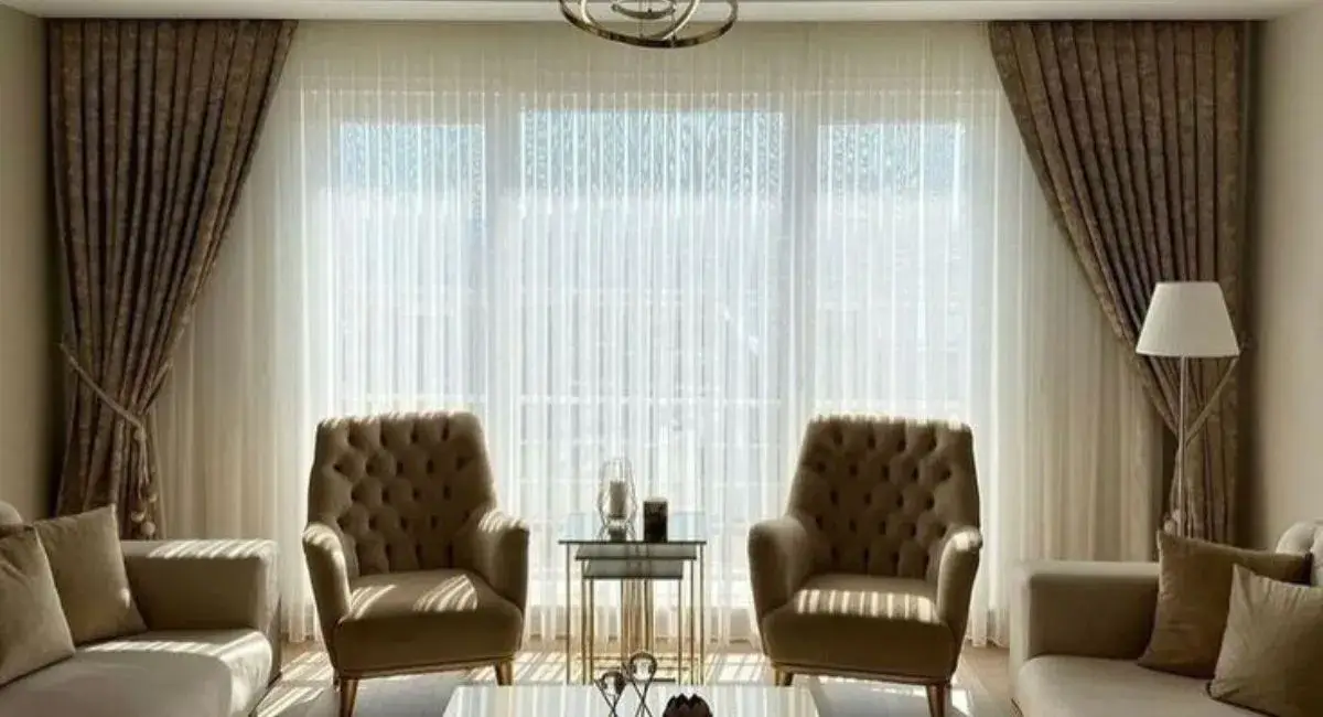 "Elegant ceiling-mounted curtains in a modern living room, enhancing the space with height, style, and functionality."