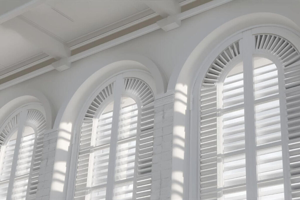 Louvered arched shutters with adjustable tilt rod