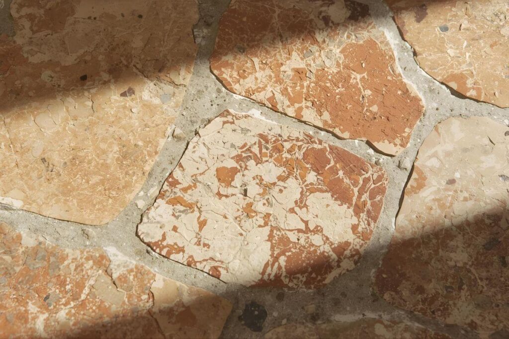 Terracotta and natural stone flooring in modern Mediterranean home