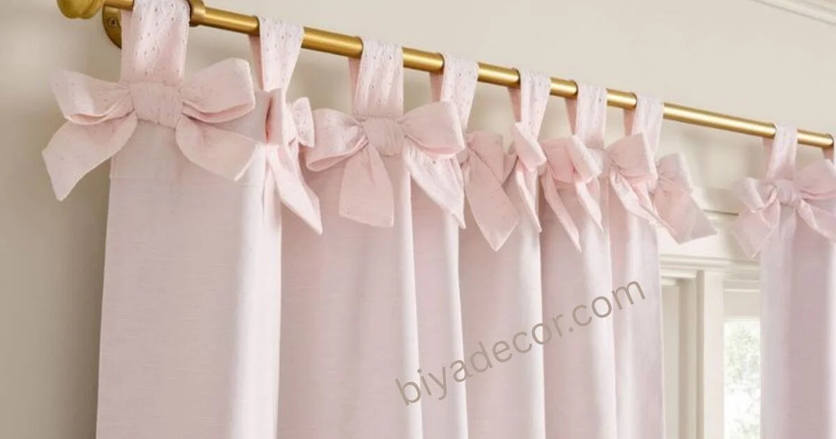pink tie top curtains hanging on the rod